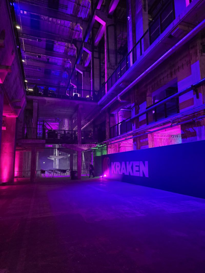 Kraken activation inside a neon-lit industrial venue in Berlin