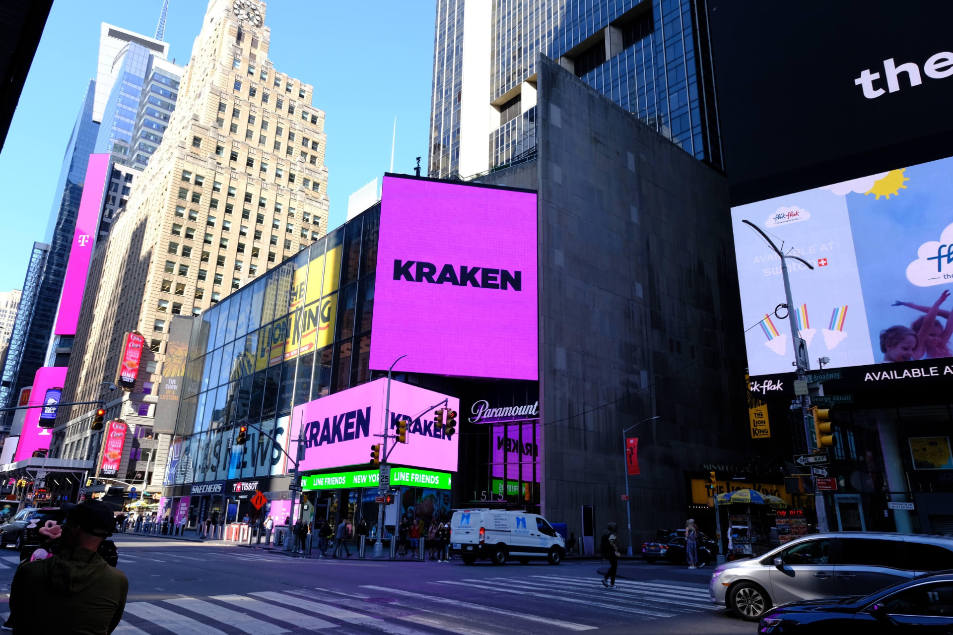 Kraken screens across Times Square buildings in daylight